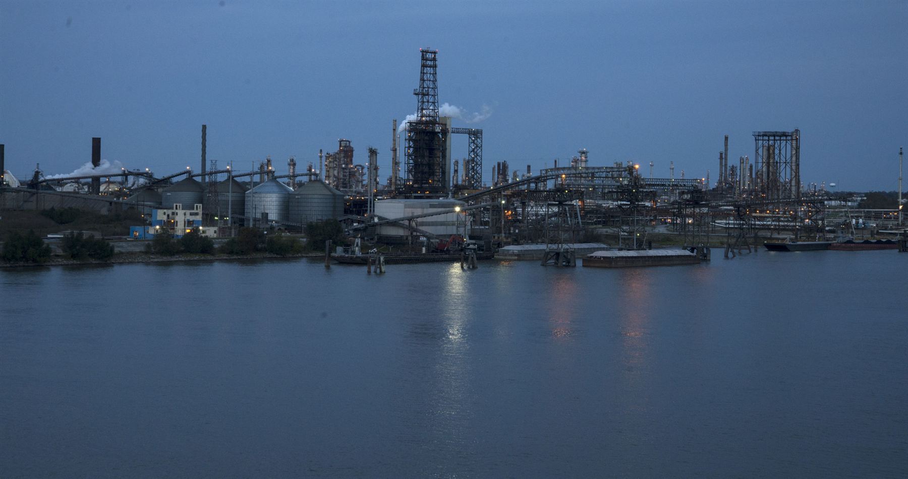 Oil refinery and process infrastructure photographed from a secured perimeter